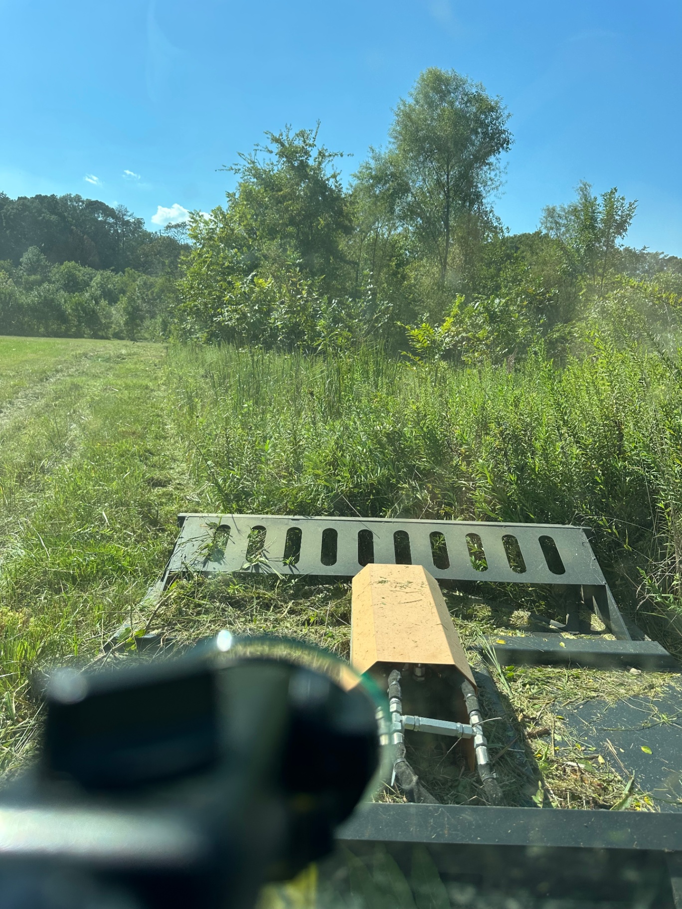 Bush hogging an overgrown field